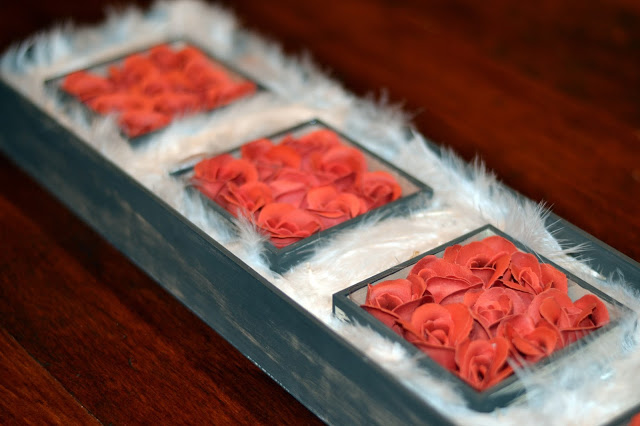 wooden box turned into feather and rose centerpiece white feather and rose centerpiece