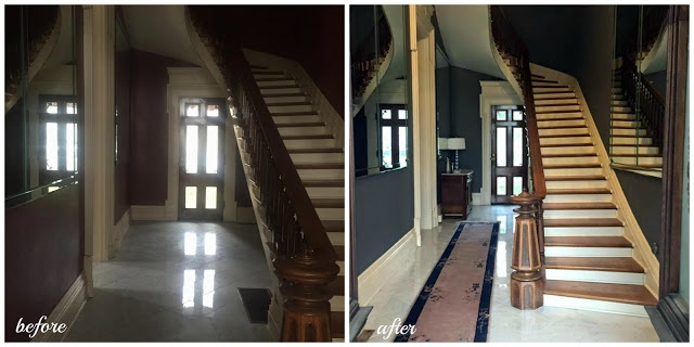 foyer with curved staircase and marble in historic home in Indiana