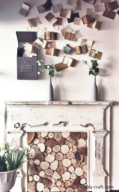 Magnolia Market staged fireplace with logs and books fireplace at magnolia market